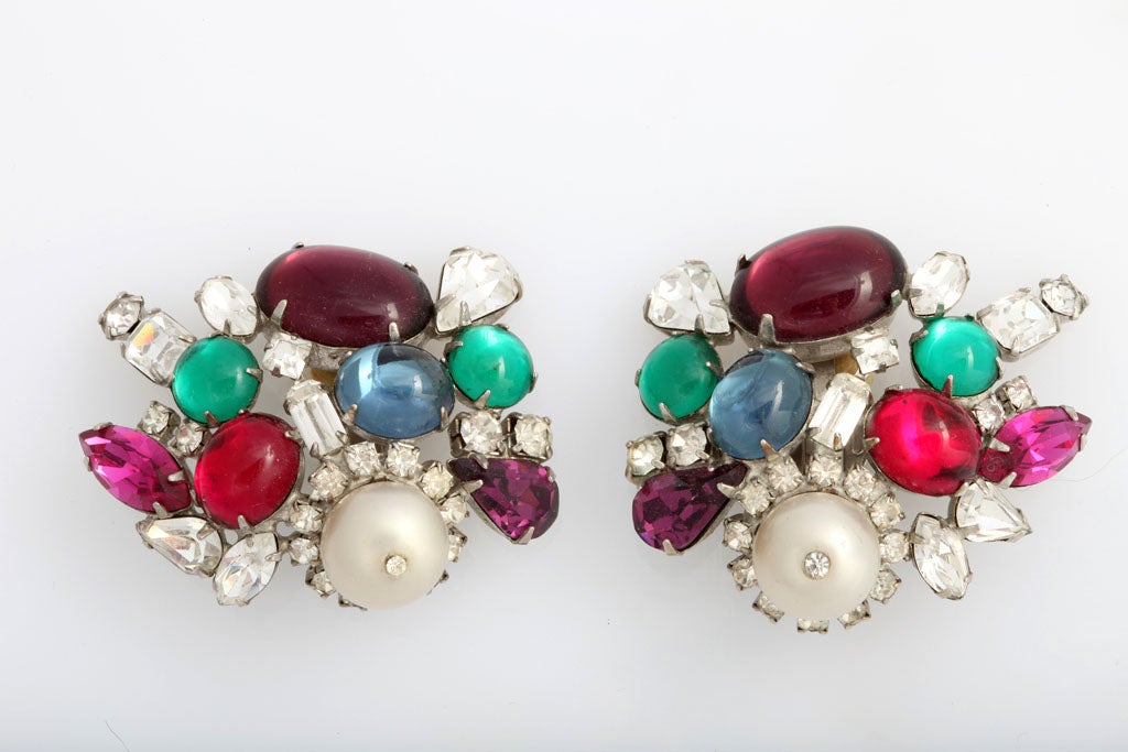 Wildly colorful and bold clip earrings with faux pearls, diamonds, and multiple colored stones.