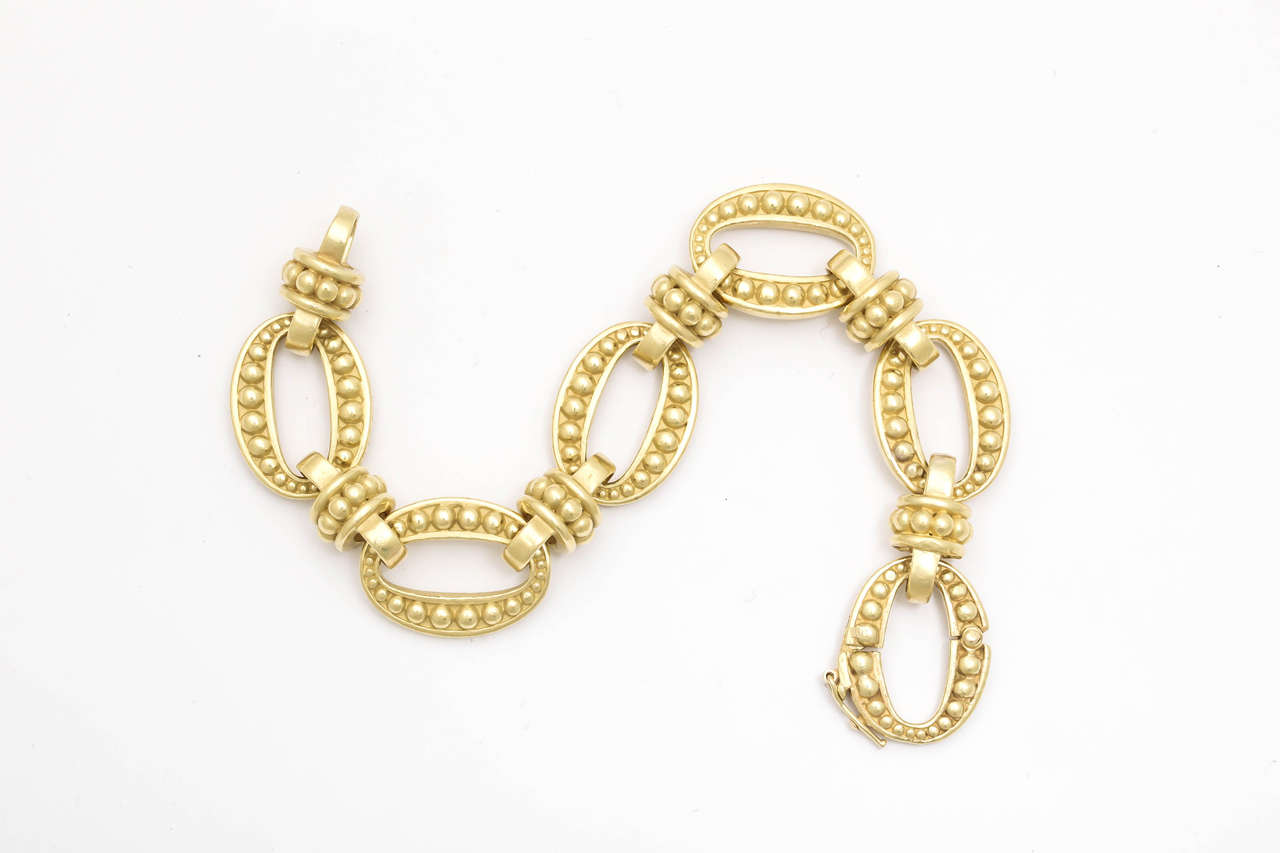 18kt green gold flexible and versatile link bracelet with each link and connector links embellished with numerous 18kt gold studs for a beautiful reptile effect that Barry Kieselstein-Cord is known for . This is a beautiful heavy and great quality