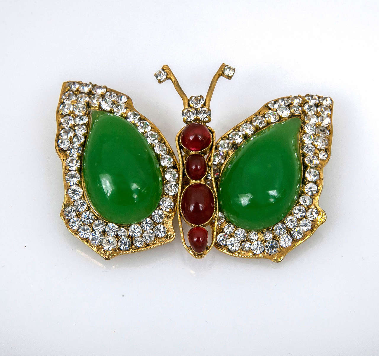 A rare and exquisitely made gripoix butterfly brooch with poured glass. All original stones. In Box.
