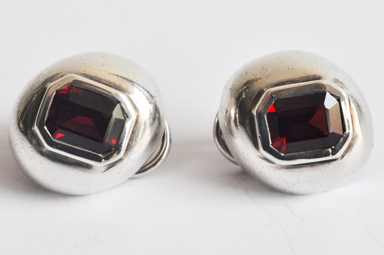 A pair of sterling silver clip earrings with synthetic rubies in a beautiful Tiffany setting.