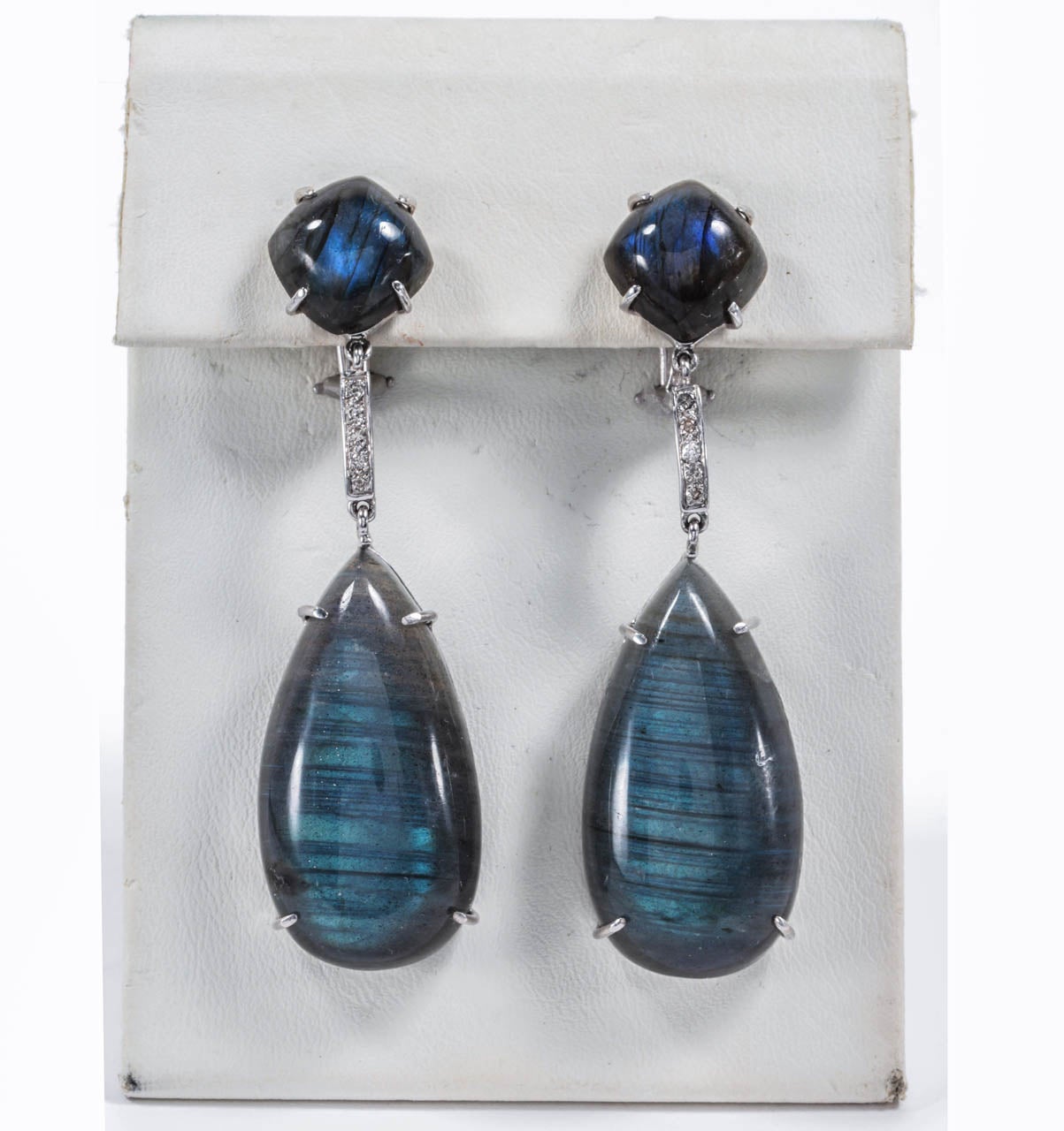 18kt White gold Earrings with cabochon Labradorite drops finished with diamond connector.  can be posted or clip.  The length of the earring is 2 1/2