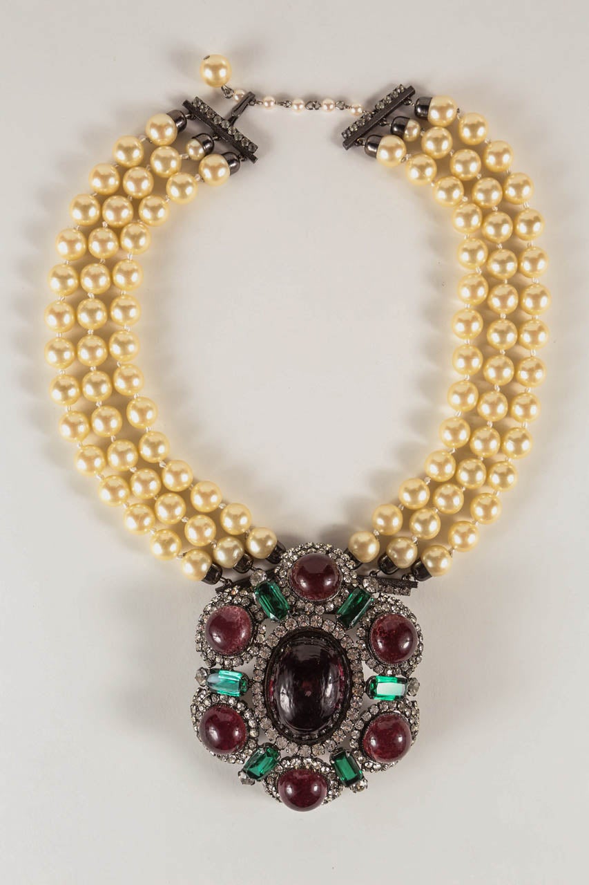 A dramatic necklace & ear clip set by noted costume jewelry designer Lawrence Vrba, who worked for Miriam Haskell before launching his own line. The large-scale pendant/brooch, which measures 4