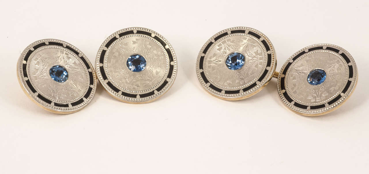 Pair of 1950s cufflinks with black enamel border, mounted in 14kt yellow gold and faced in 14kt white gold.