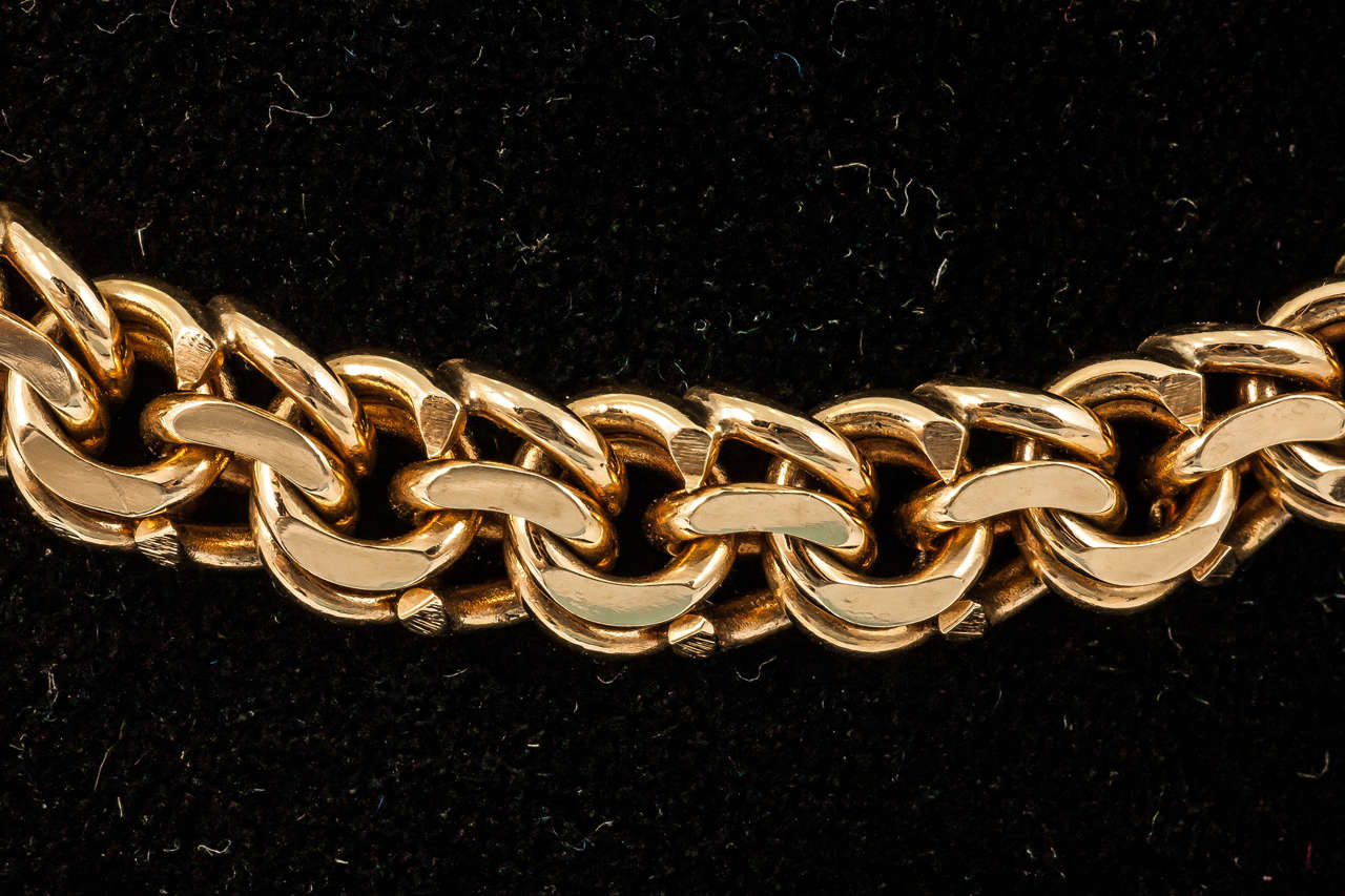 Fine quality heavy 18kt gold necklace signed Tiffany and Co of flat,entwined circular links, circa 1960.