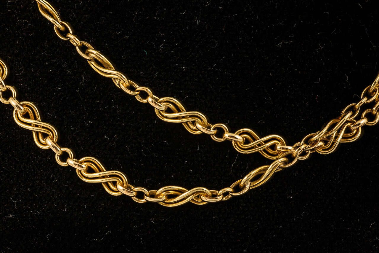 A finely made long 18kt gold French marked necklace of double, figure of eight links, with a soft patina circa 1900.
