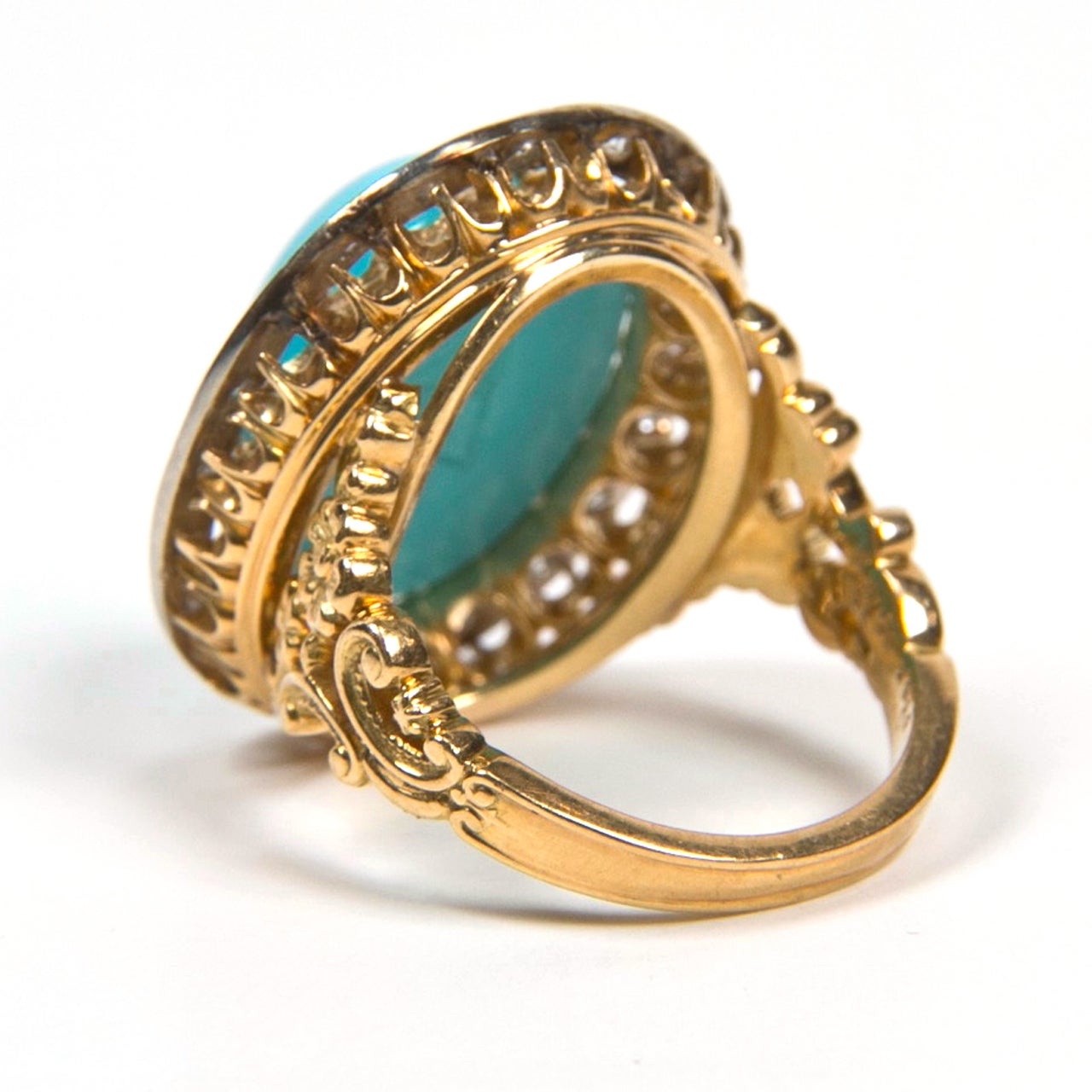 Large Turquoise  Stone  in Diamond Surround and Gold Ring  