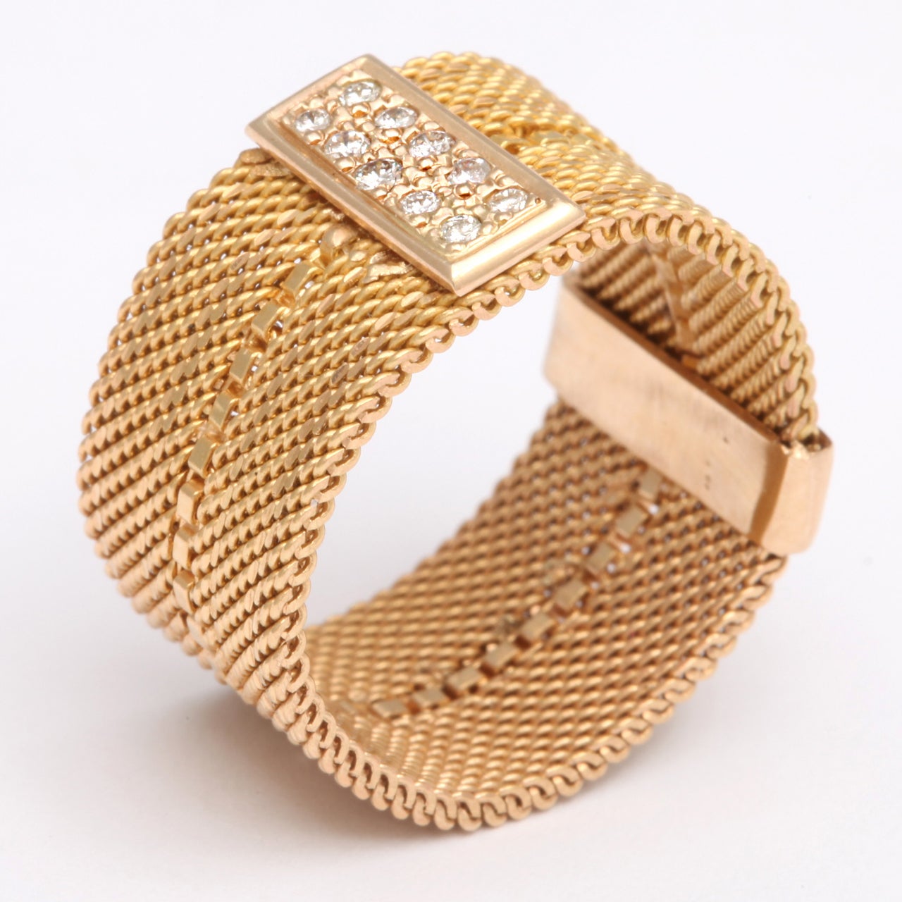 A great 18 kt flexible wide woven band with plaque of ten small diamonds. Size 6