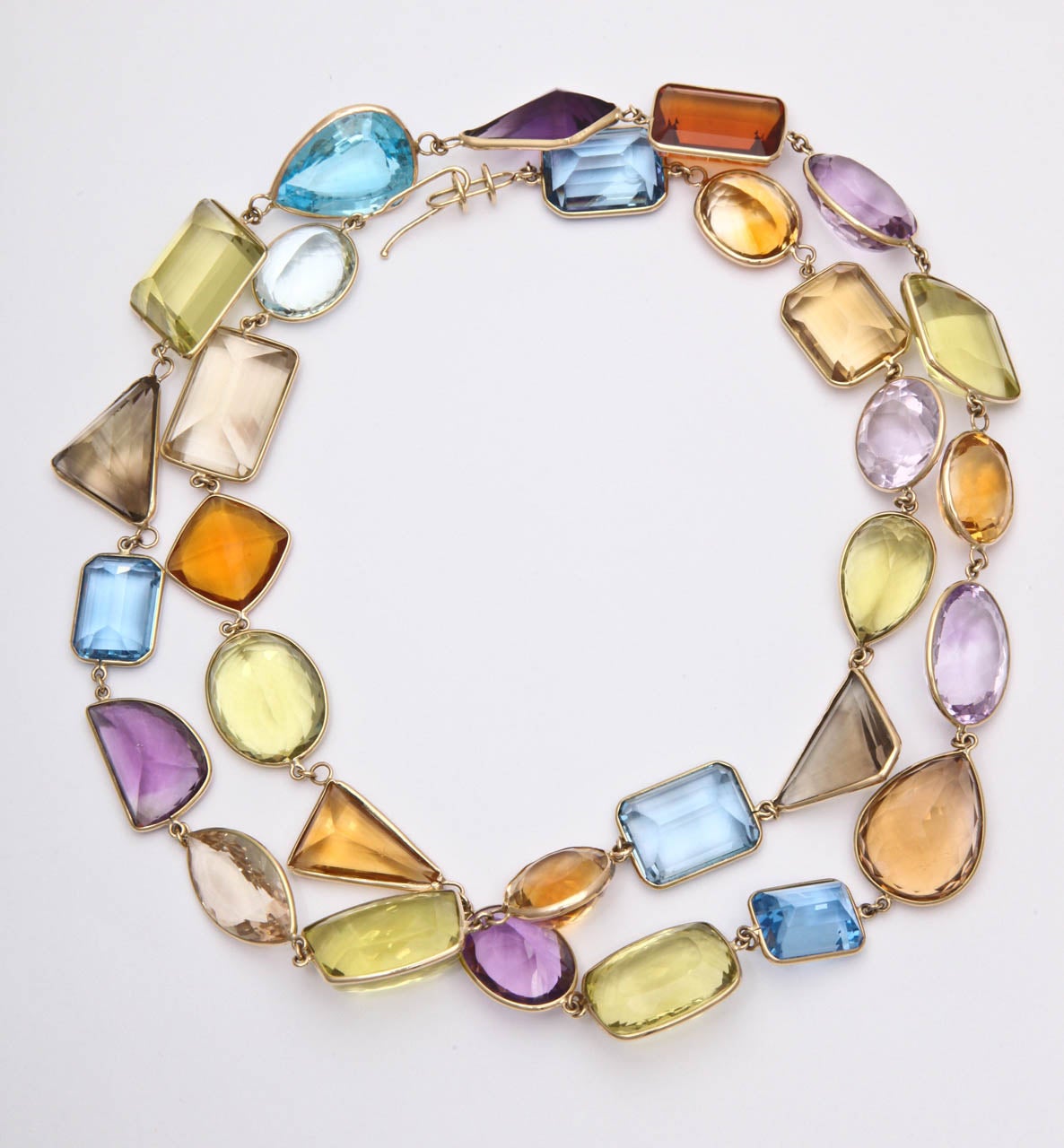 18kt yellow gold bezel set multi colored stone gem set long necklace may be worn doubled 