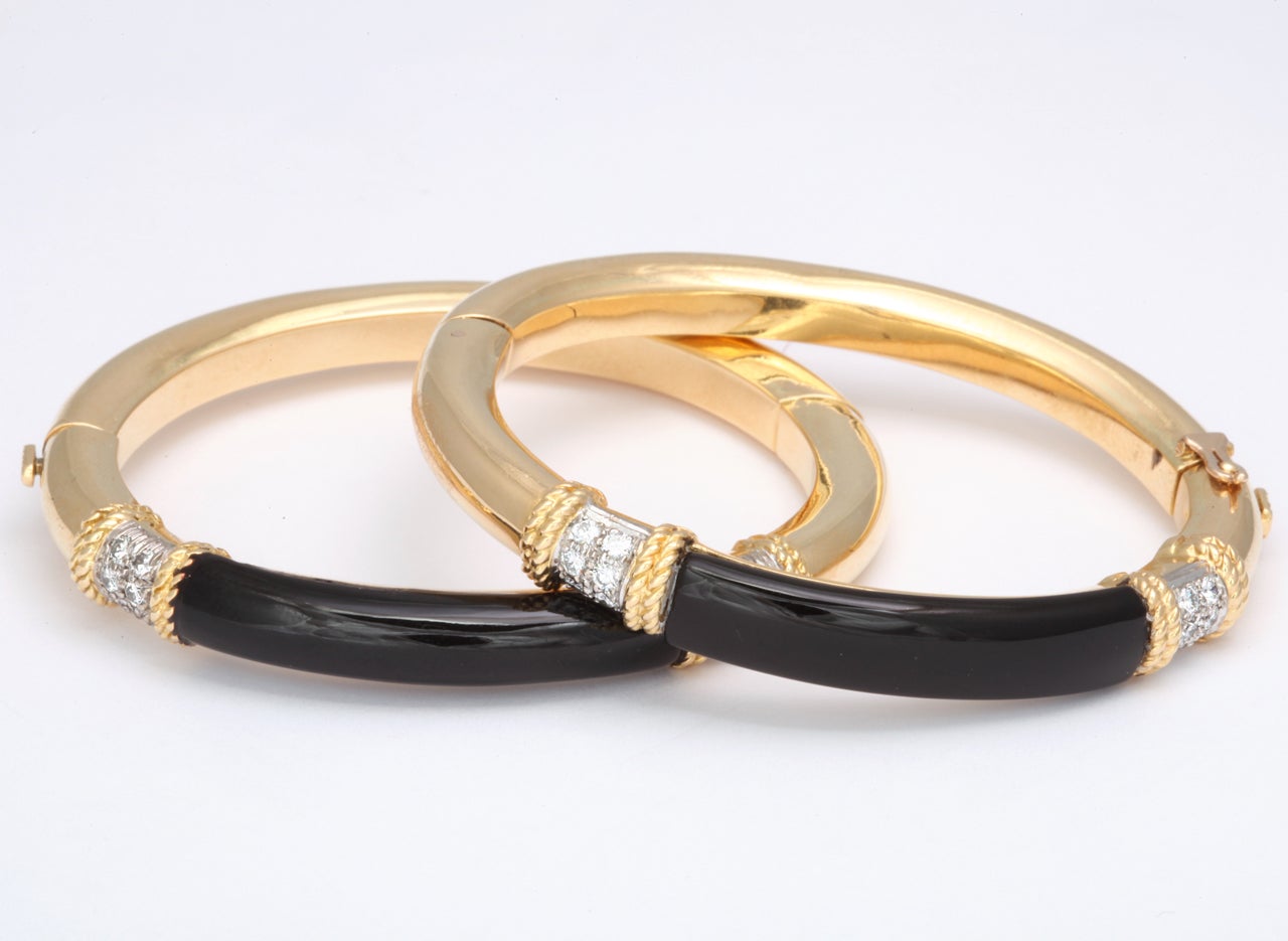 ENGLISH 18kt yellow gold and black enamel and full cut diamonds pair of bangles fits small wrists only