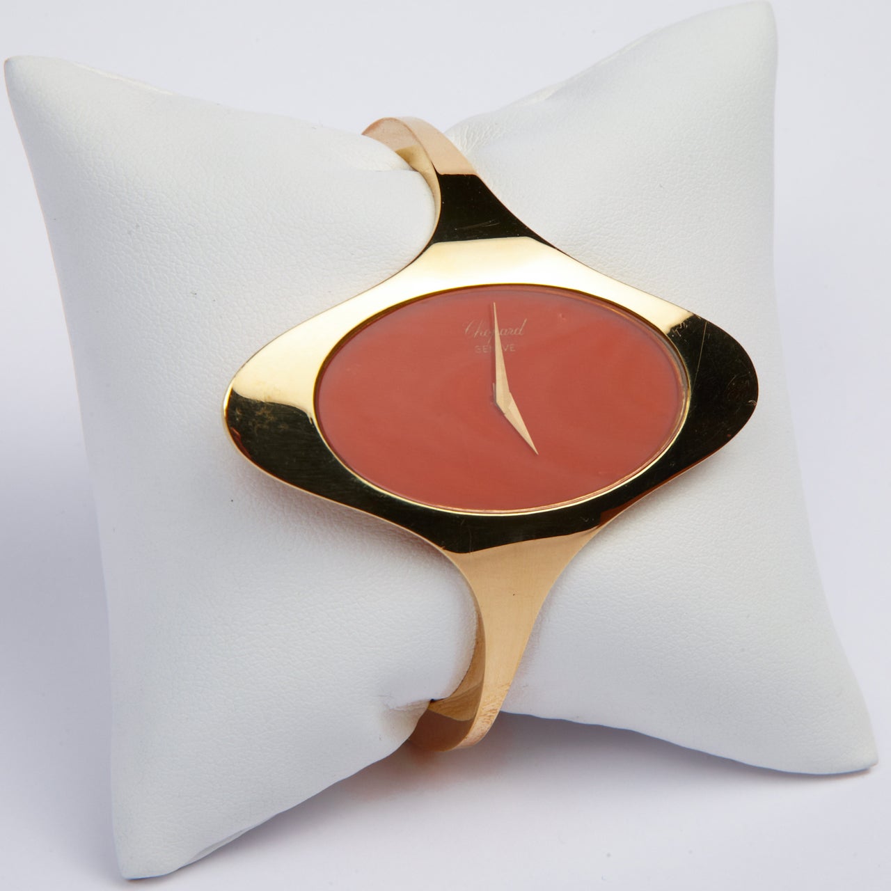 Chopard 18k yellow gold lady's bangle bracelet watch with coral dial.