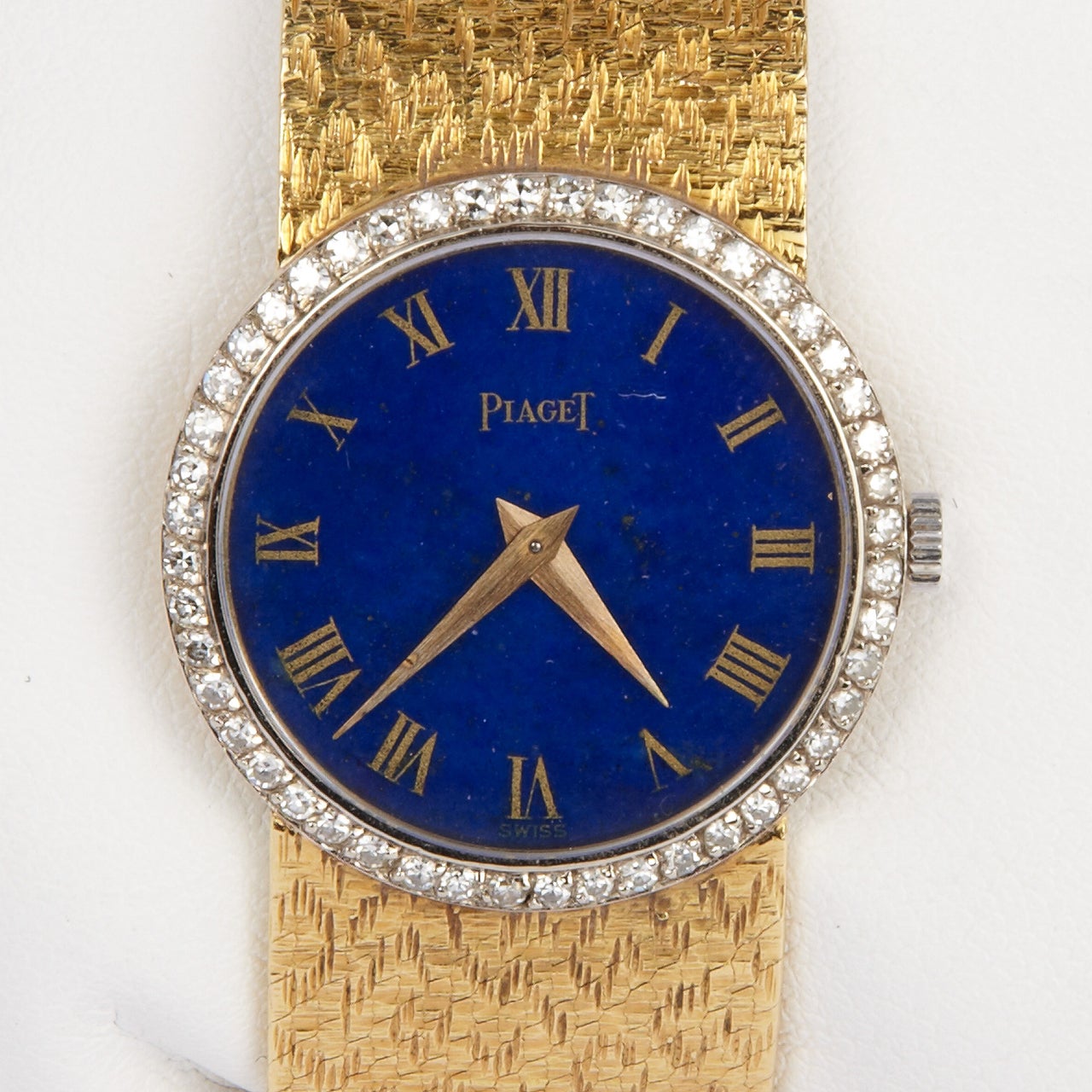 Piaget lady's bracelet watch. 18k yellow gold and diamonds with lapis lazuli dial, circa 1970.