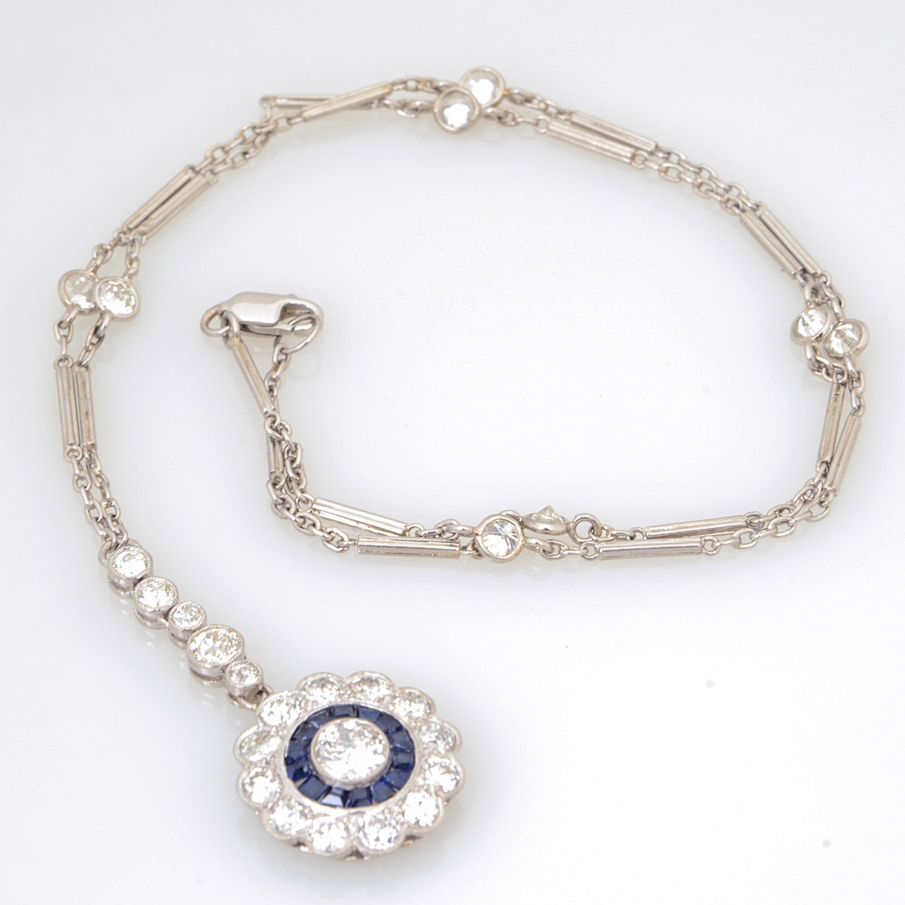 Art Deco Floral Sapphire and Diamond Platinum Drop Pendant Necklace In Excellent Condition In Miami Beach, FL