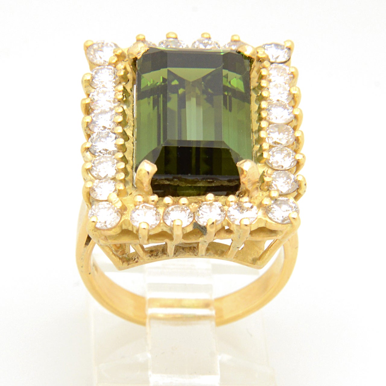 Truly elegant ring featuring an emerald cut green facetted tourmaline prong set amidst a diamond frame.  The frame contains approximately 1.95 carats of diamonds.
It is a US ring size of 6.5 which can be sized.