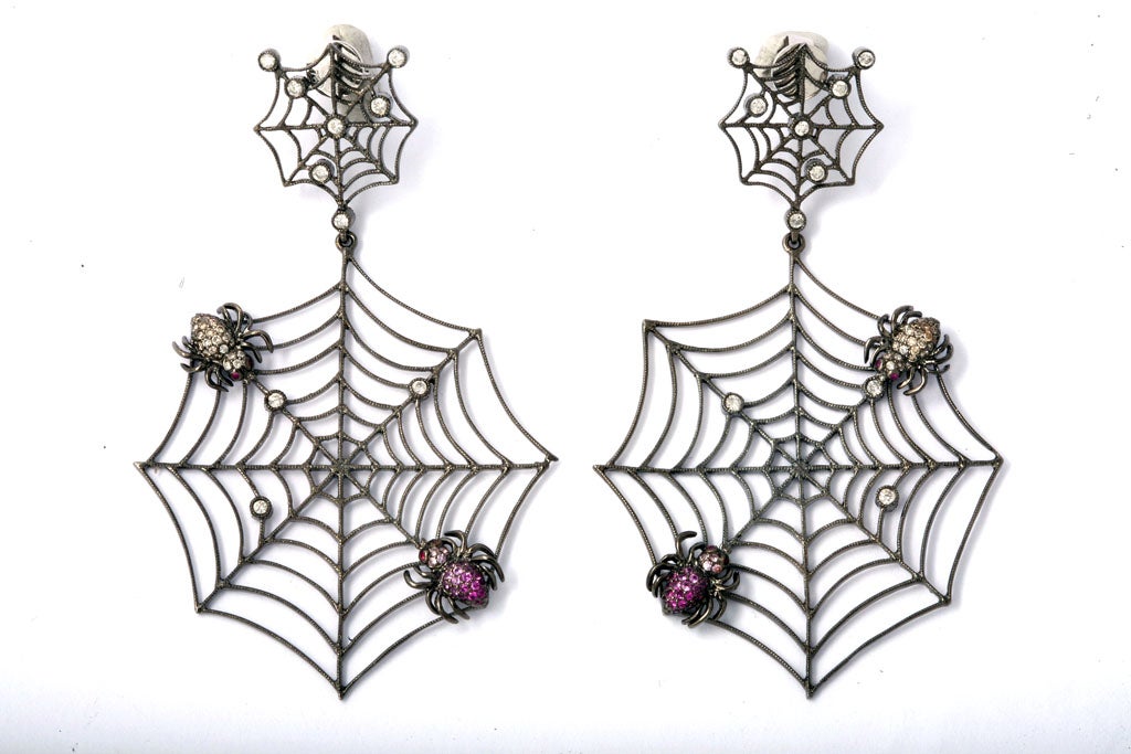 A pair of 18kt white gold spider web earrings. The earrings are embellished with diamond raindrops and sapphire spiders.<br />
From the Jaipur Collection Designed by Rebecca Koven