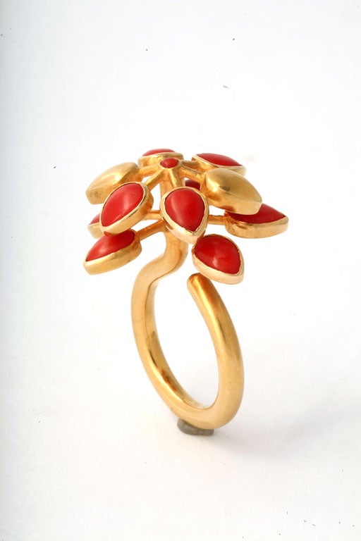 An 18kt yellow gold and coral ring. The two layers of coral petals spin when being worn.

From the Jaipur Collection Designed by Rebecca Koven