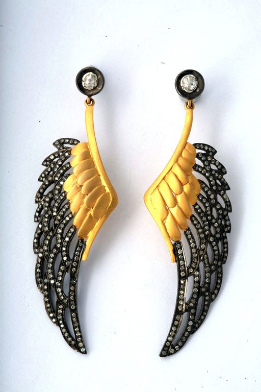 A pair of 18kt yellow gold, sterling silver and diamond wing earrings. The wings are suspended from rose cut diamond studs. There are approximately 2.50cts of diamonds.<br />
From the Jaipur Collection Designed by Rebecca Koven