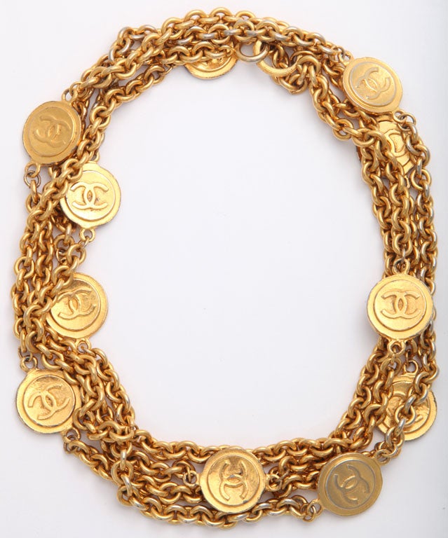 chanel gold tone heavy chain necklace consisting of eleven chanel logo disc's
