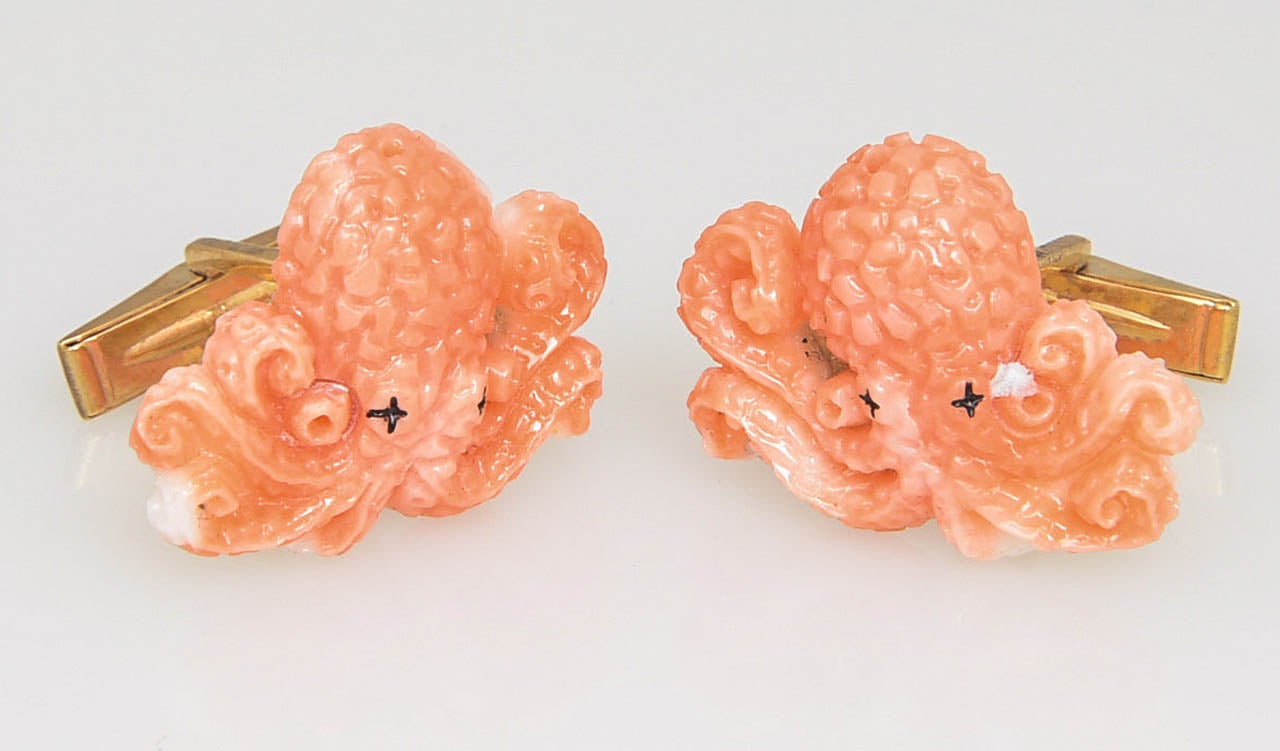 Carved coral cufflinks with hinged t-backs. 
Coral depth .12