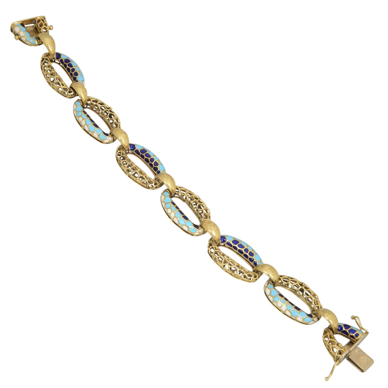 Finely made Italian enamel bracelet with links that are half gold honeycomb pattern and the other half navy, baby blue, and white enamel.  These links are connected with a florentine finish gold bridge.  It was made between the 1960's- 1970's.  18k