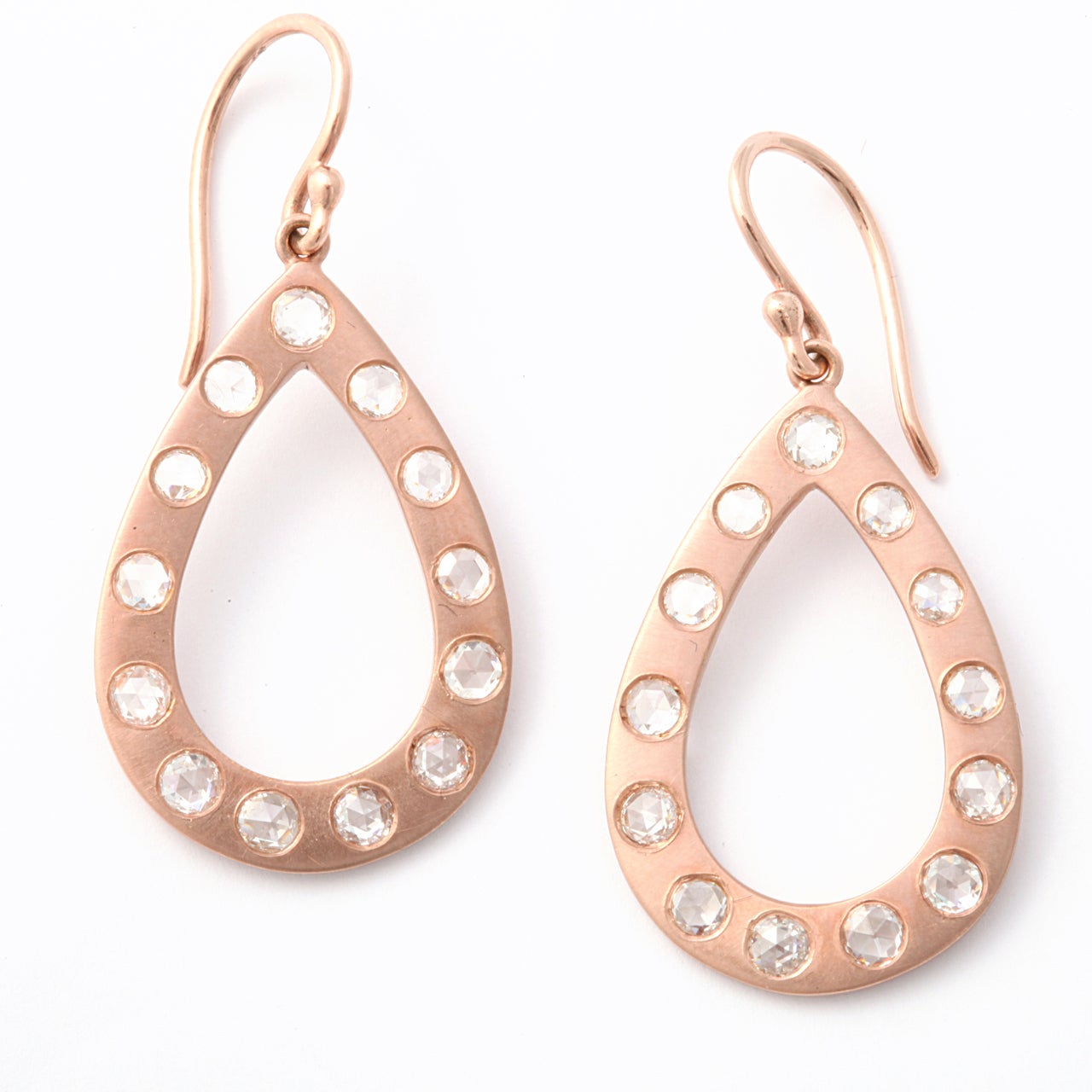 open rose gold pear shape applied with 26 rose cut diamonds approximate weight 2.80 carats