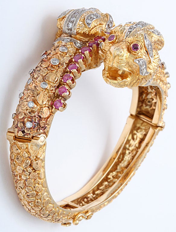 18k yellow gold textured bracelet 83.4 grams
20 round rubies
88 diamonds 2.00 carats