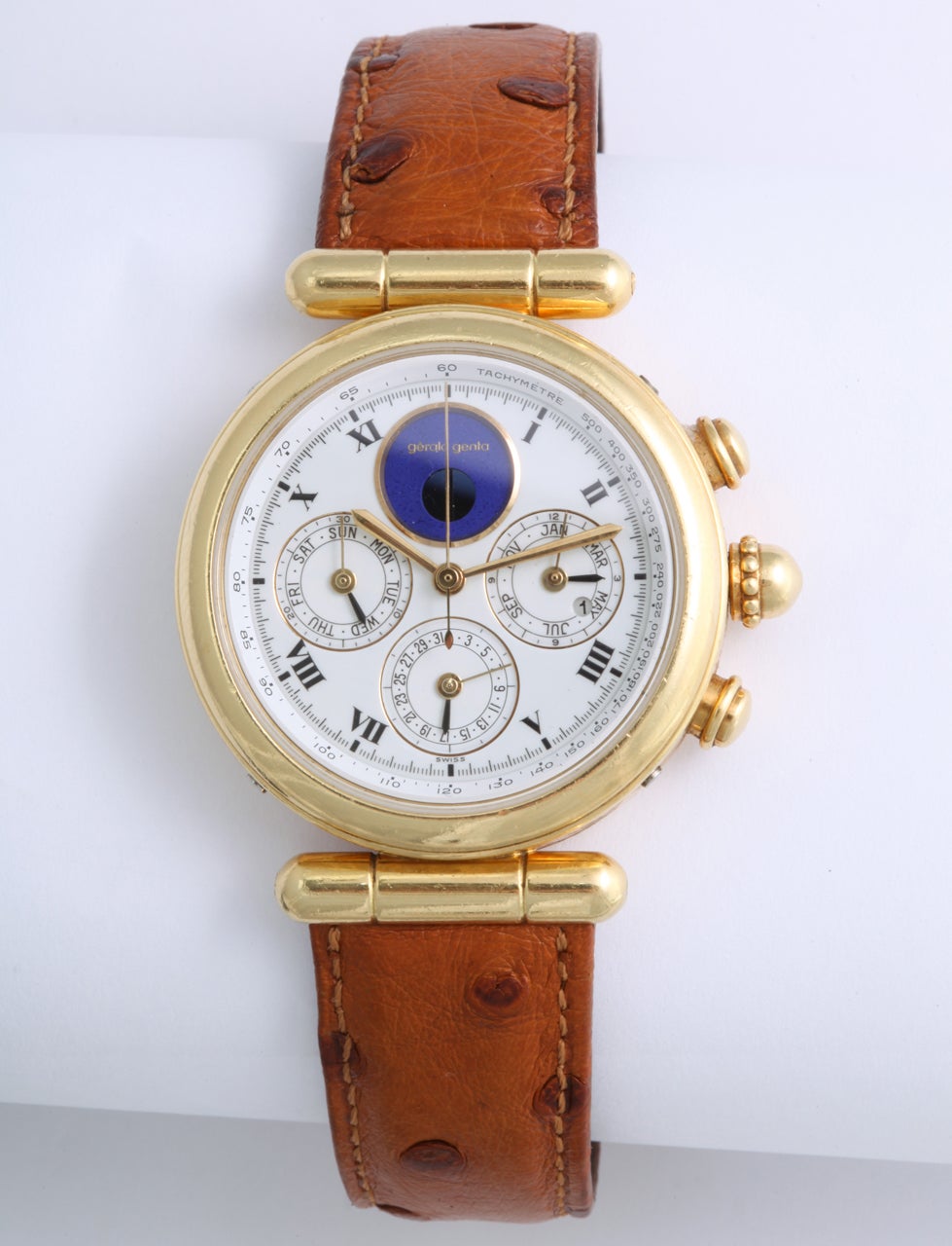 Gerald Genta 30 Year Perpetual Calendar Chronograph Wristwatch

Movement: Quartz
Case: 18k Yellow Gold
Dial: White with Roman Numerals
Functions: hours and minutes; perpetual calendar (date, day, month, moon phases, leap year