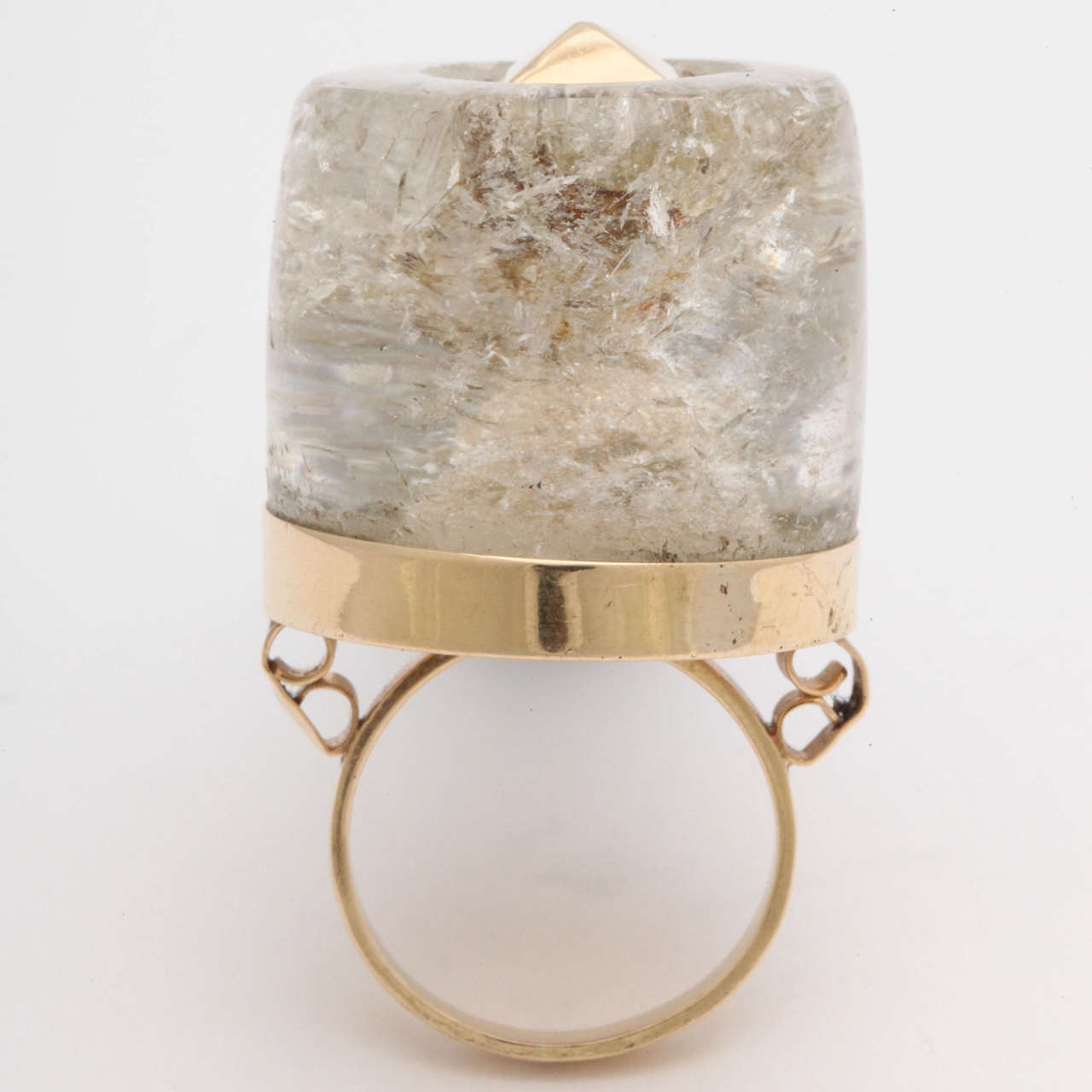 18 KT Yellow Gold Large Cocktail Ring Centering a 20 Carat, Three dimensional Rock Crystal Stone & Further Embellished with an 18KT Yellow Gold Studded Center.

Ring Size 7
American Made 1950's
Ring may be sized to any size