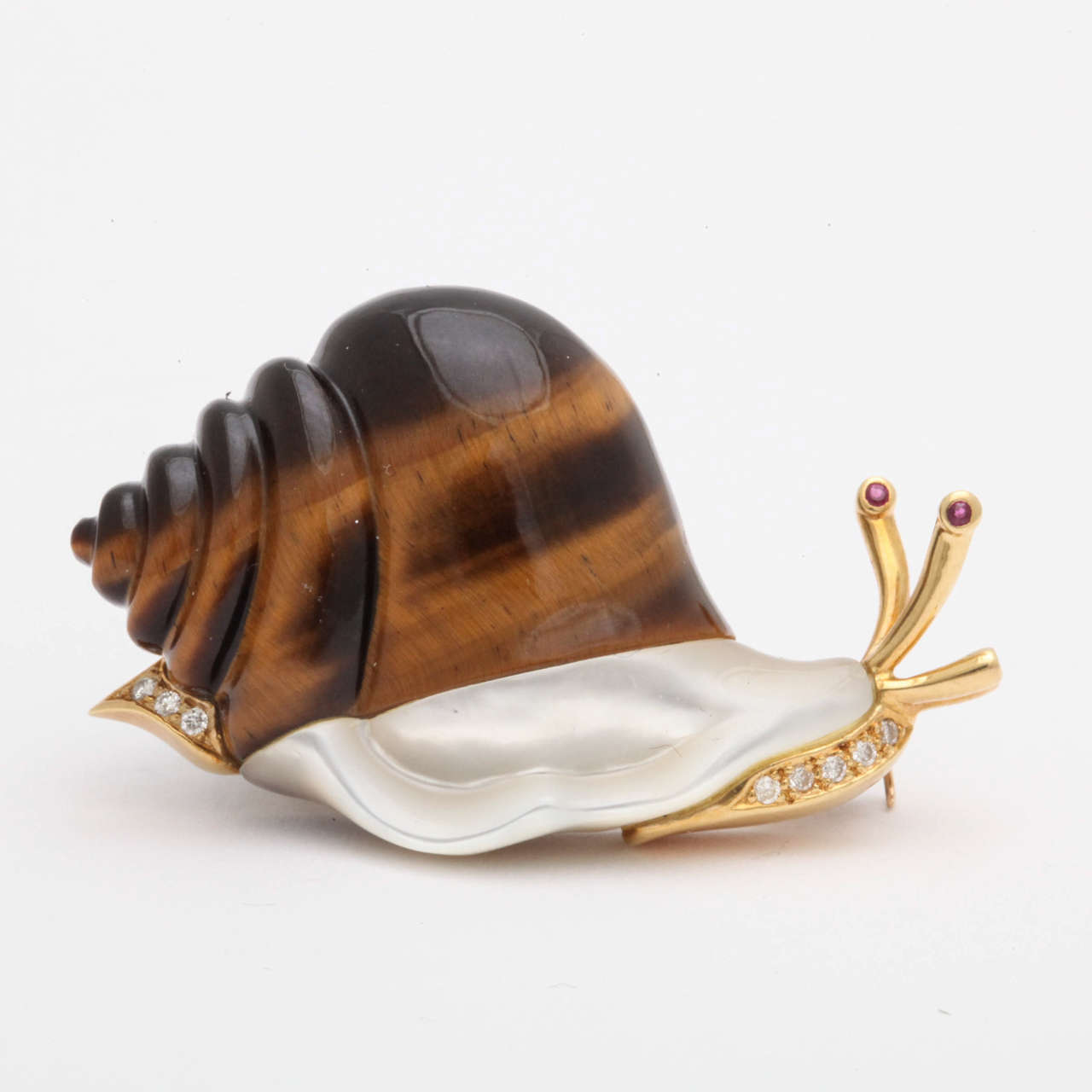 18kt yellow gold hand Carved Tigerseye whimisical Crawling Snail Double Clip Brooch May be Worn Horizontal Or Vertical Furher Embellished With A High Irridescence Hig quality Mother of Pearl And Further Decorated With 8 full cut diamonds and 2 Burma