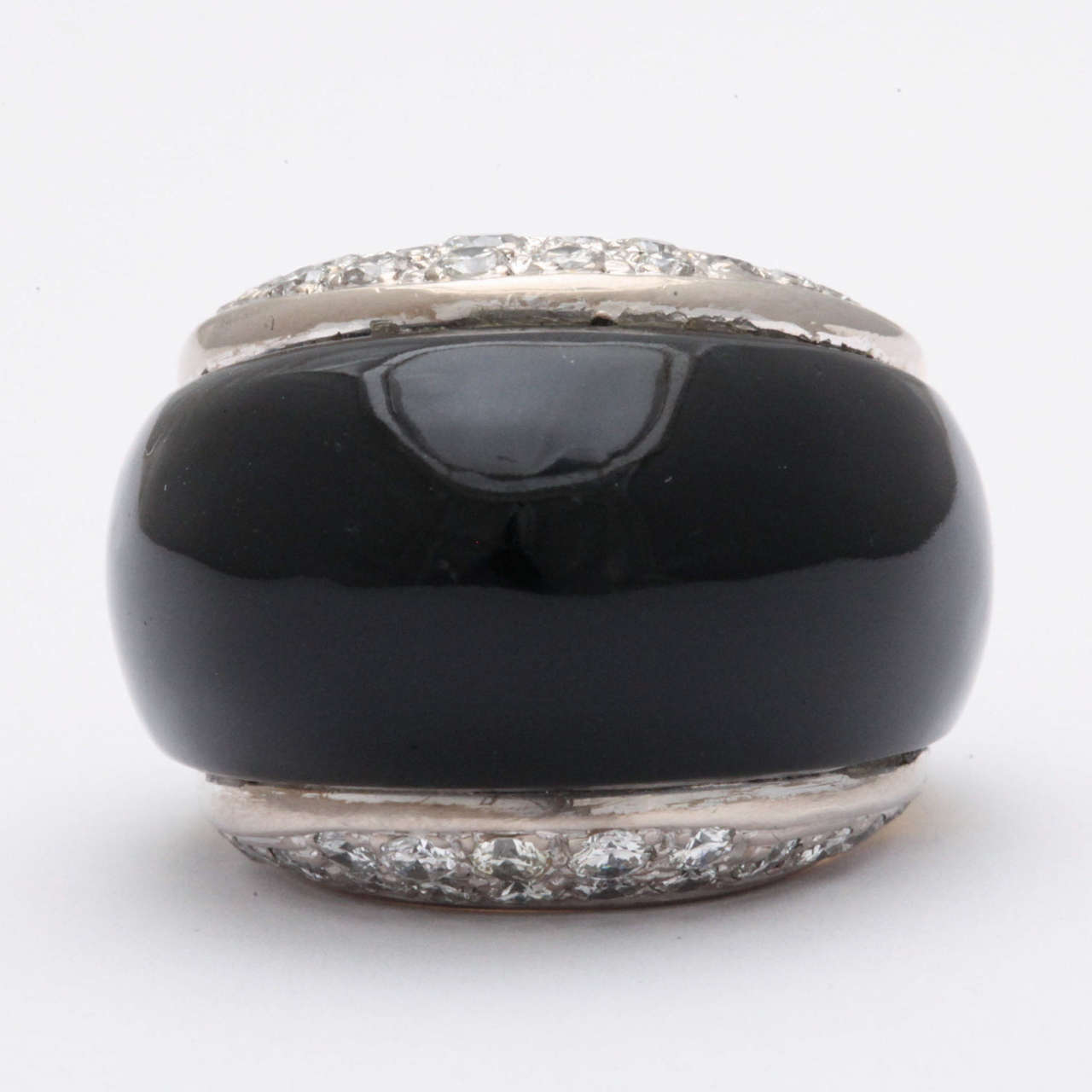 High style 18kt Yellow Gold Ring with pave set Diamond sides set in Platinum and polished Black Onyx Body.  Super sophisticated. Size 6.5