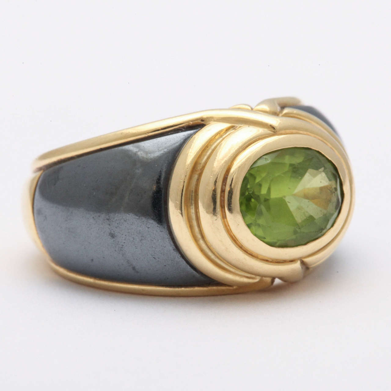 Signed Bulgari, Steel, 18kt Yellow Gold & Faceted Peridot Ring.   Very chic pinky Ring.