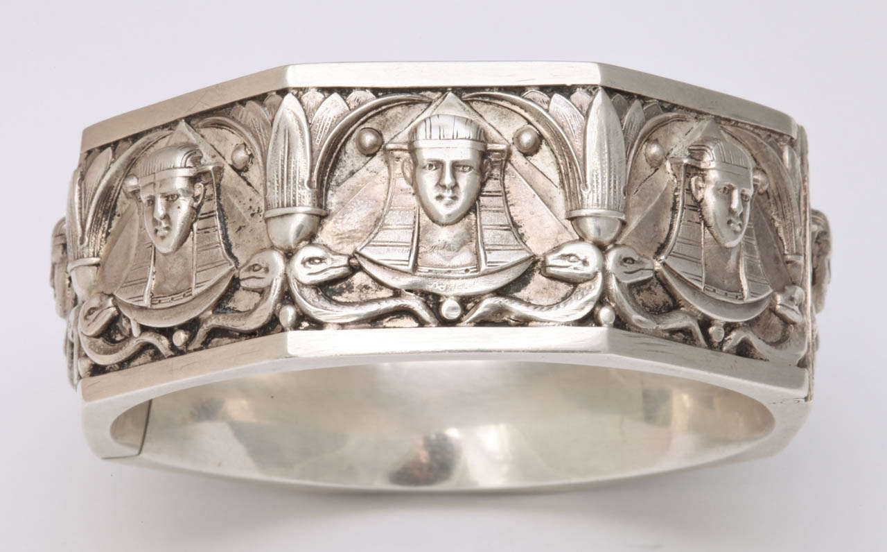 Price Markdown......The architectural image of the sphinx is embossed all around a remarkable silver bangle. The amount of fine work done to create this bracelet makes it a work of art. Each sphinx has a different face and hair or no hair. Gleaming