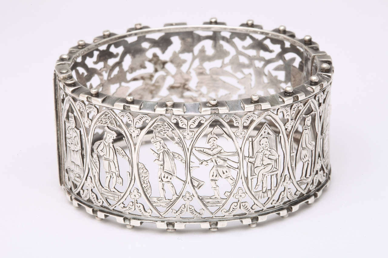 Lacy silver with endless detail depicts on one side the seven stages of a man's life from youth to hunter and provider to becoming a king and reaching advanced age. The reverse is the natural world of doves, and plants and the peace that nature adds