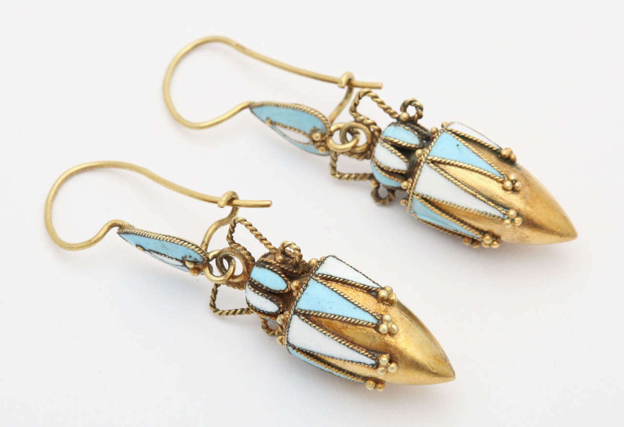 Daniela Mascetti and Amanda Triossi picture these Inverted blue hearts or shields that suspend urns of blue and white enamel  on 18kt gold on page 100 of their exemplary text "Earrings. In person, the detail of the earrings is superb.  Small