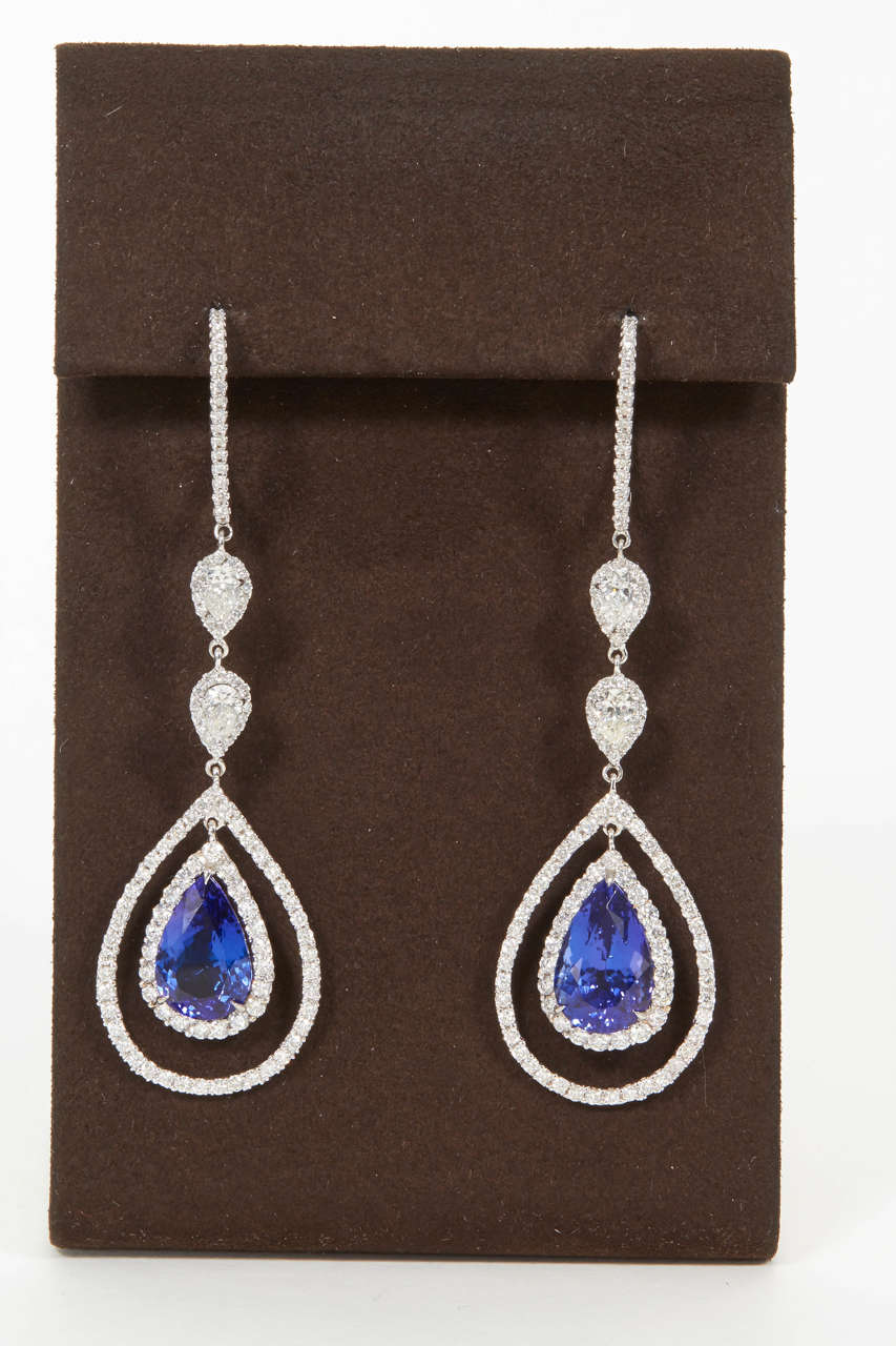 Gorgeous royal blue color tanzanite and diamond drop earrings.

11.98 carats of tanzanite.

4.70 carats of diamonds.

Approx 2.75 inches in length.