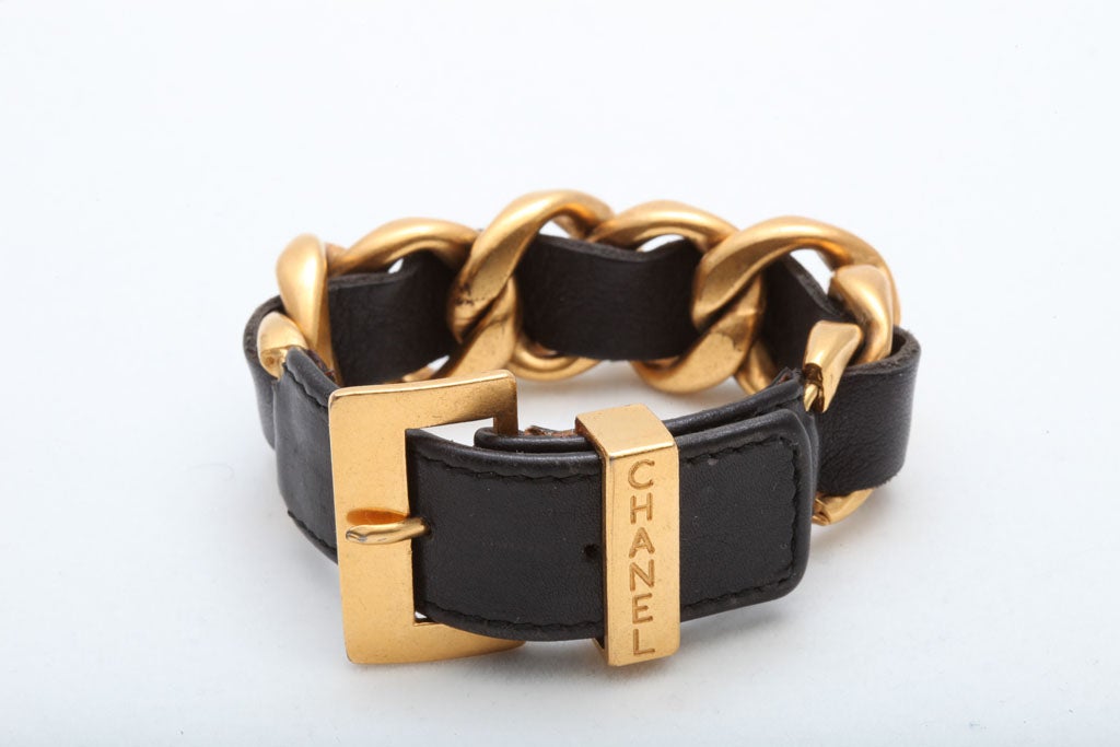 Chanel signature gold/black chain bracelet.
fits most, belt hoop 8 - 8.5 inches.