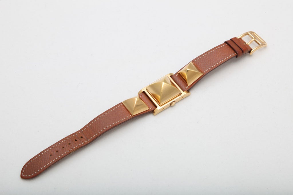 Hermes Medor Watch. Brown belt with gold studs.
Width 1 inch. total length 8.5 inches.