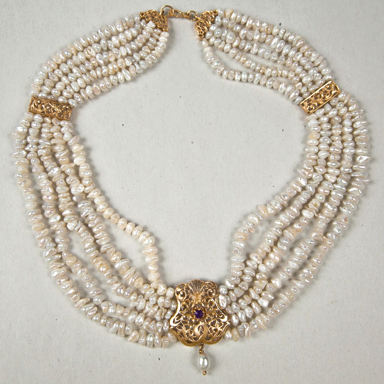 Five Strand Baroque Pearl Festoon Necklace with draping swags of natural baroque pearls and solid 18K gold stations. Unmarked, gold content is tested. Victorian 1840-1860 possibly older