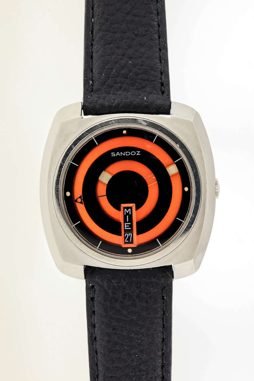 Dramatic Pop Art 1970's design and rarity set this Sandoz mystery dial wristwatch at the top of this period's collectible wristwatches. The 38mm square cushion-form stainless steel case has a screw-down back indicating 'water-resistant and