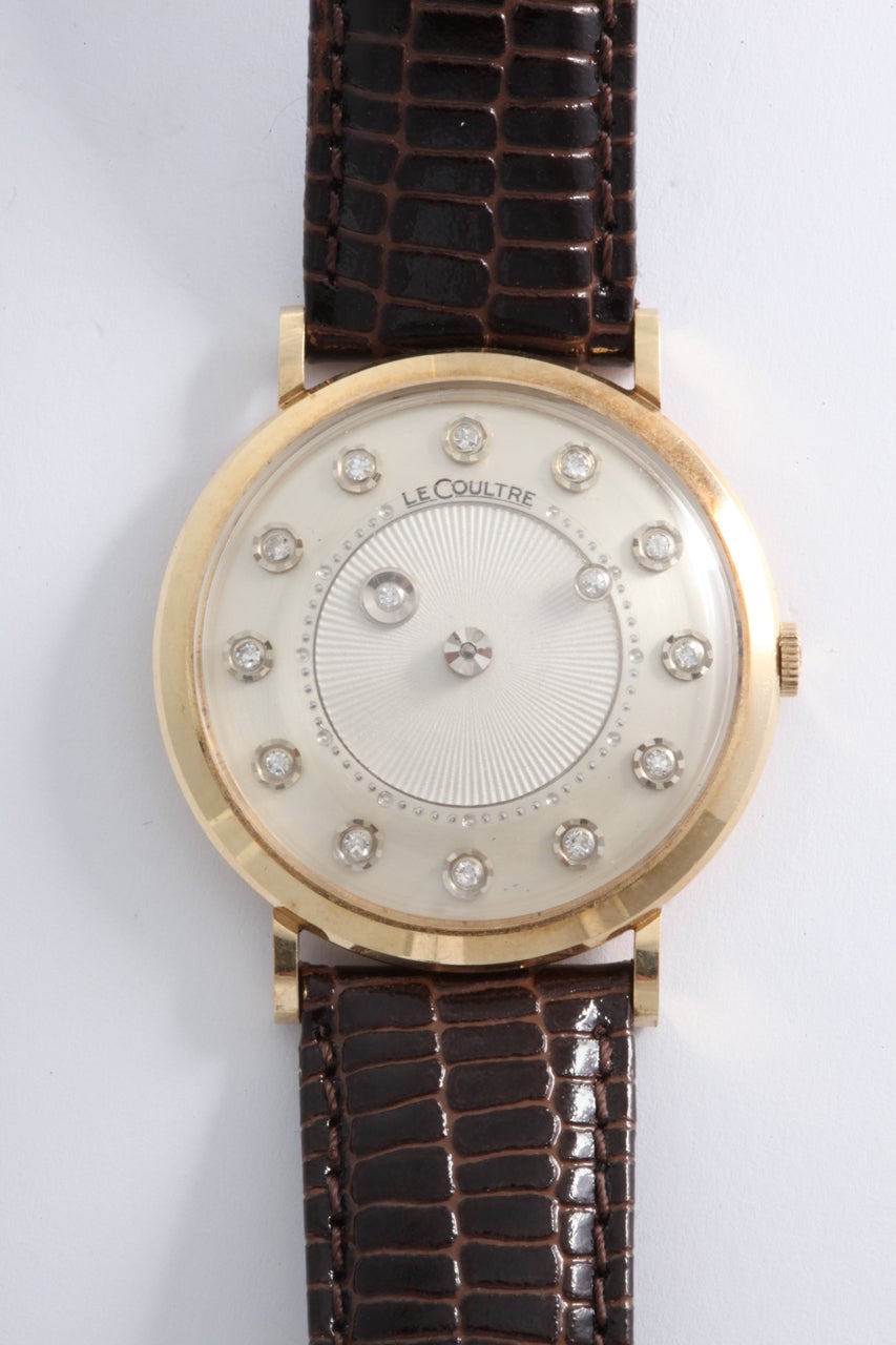 A great 14k yellow gold LeCoultre mystery watch with diamond indexes to the dial.


Description: Le Coultre gold mystery watch with diamonds