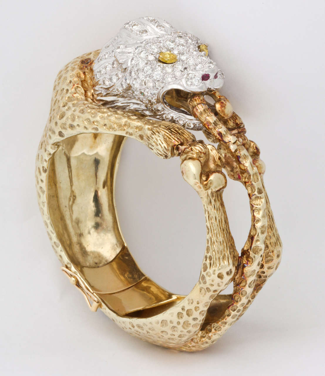 Fancy Yellow Diamond, Diamond and Ruby 18K Yellow and White Gold Lion Animal Bangle Bracelet.
Internal circumference - 7