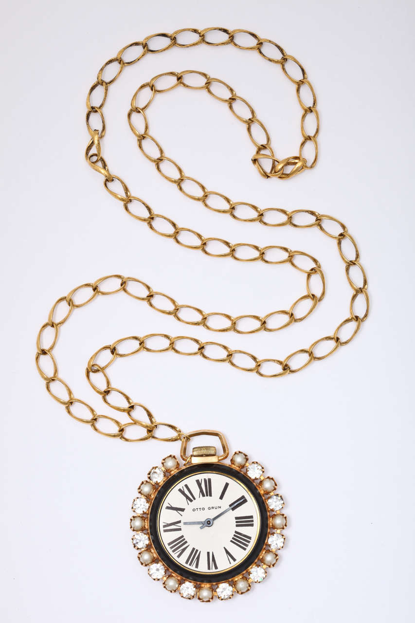 Faux diamond and pearl adorent faux watch pendant necklace. Black enameled back. Chain drop is 18.5