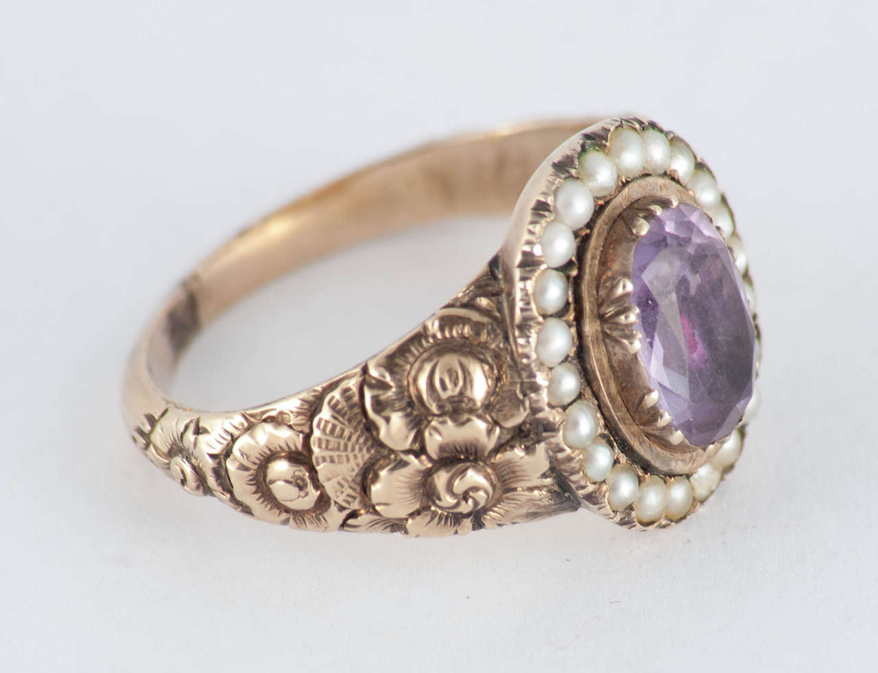 Wonderful Georgian amethyst ring in a fantastic 18K gold repose setting and surrounded by pearls. The ring is a size 7 1/2 and measures approximately 5/8