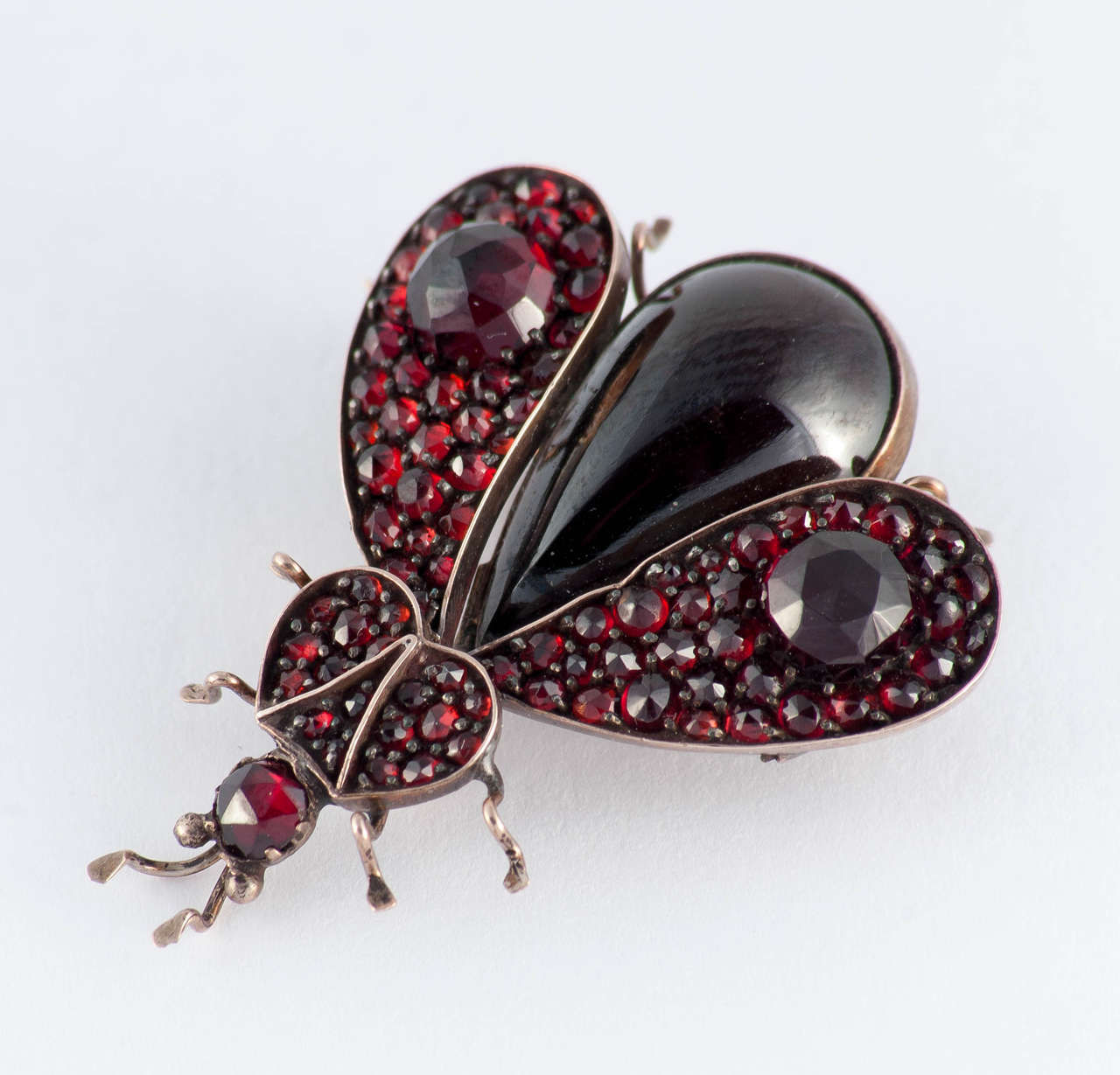 Charming Victorian Bohemian garnet bug brooch set in low carat 