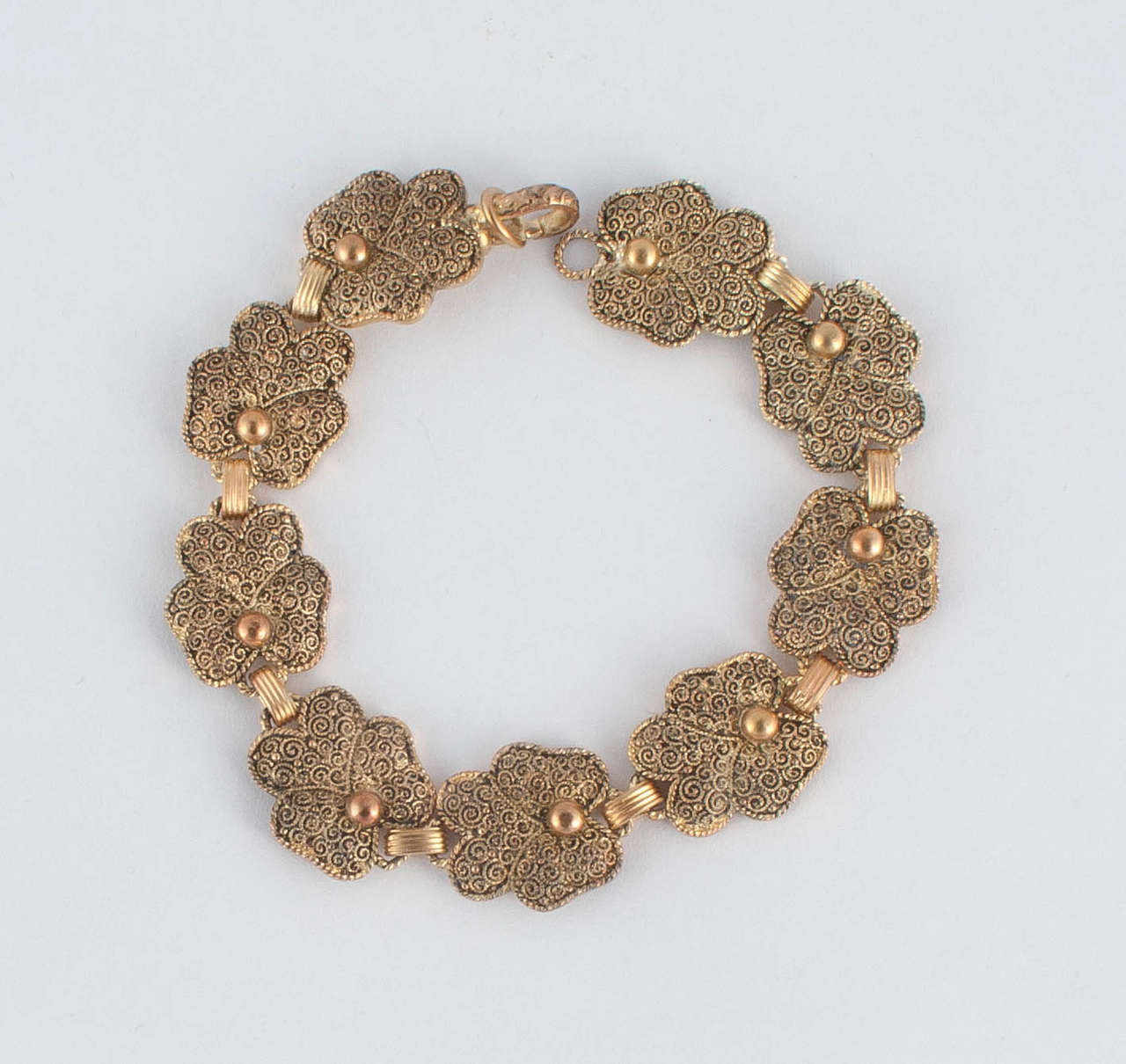 Lovely pansy motif bracelet by Theodor Fahrner in silver gilt. The intricate swirl motif on the petals gives the bold design of the piece a delicate appearance. The clasp is stamped with the 