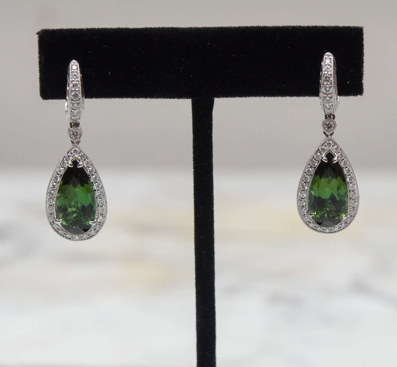 One pair of Chrome Tourmaline and diamond earrings.  The tourmalines weigh approximately 3.85cts each.  There are 34 diamonds, having F-G color and VS clarity, in each earring weighing approximately 1.02cts. Total weight for the tourmalines is