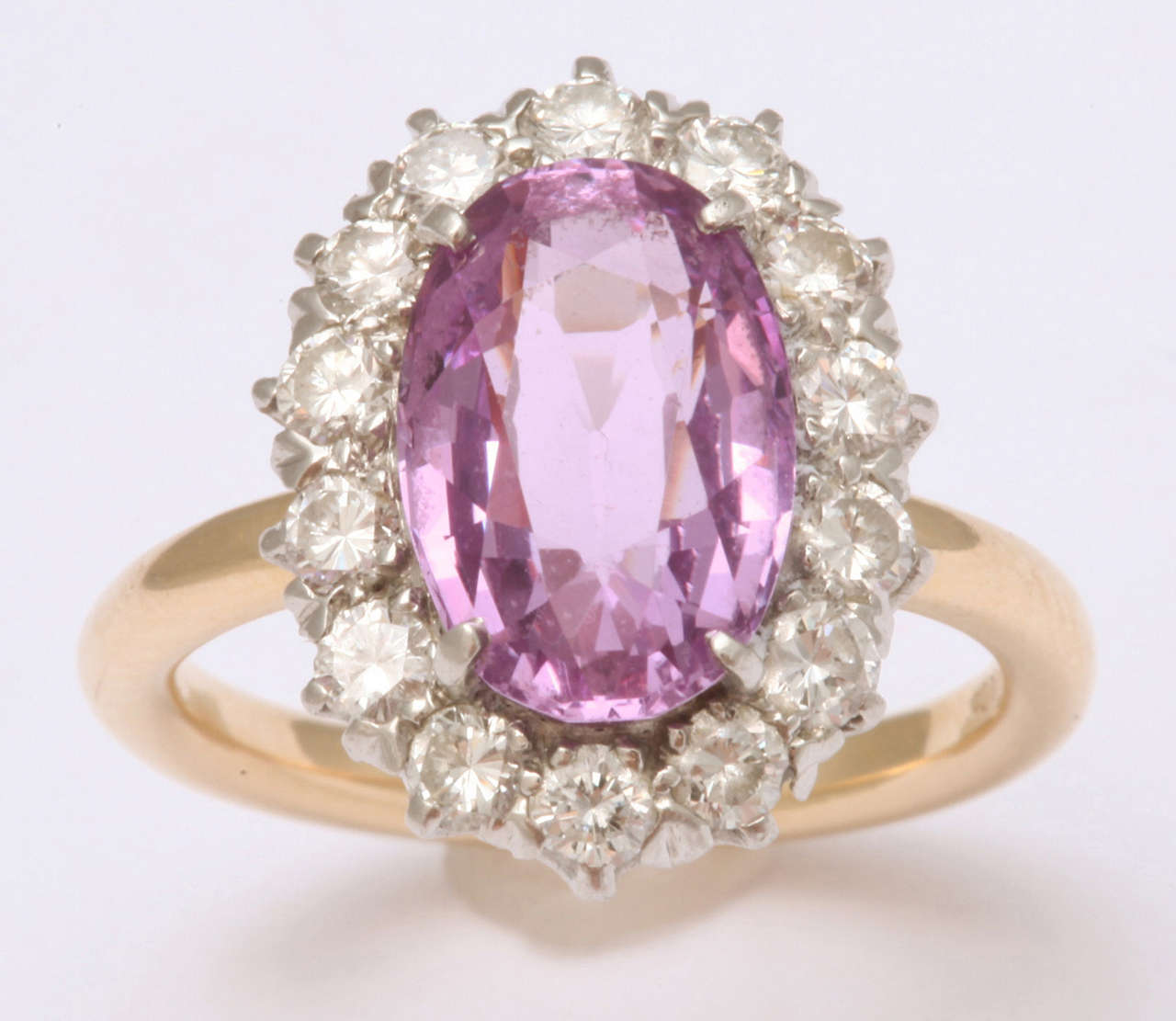 oval Pink Sapphire approximate weight 3.50 carats
14 round diamonds 1.20 carats