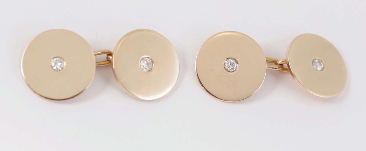 Fine quality French 18kt gold cufflinks set, centre diamond, signed Mellerio of Paris, circa 1910.