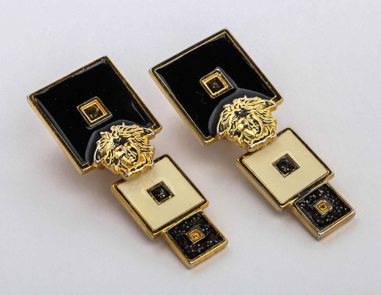 Very rare vintage Gianni Versace earrings with Medusa in black and white.