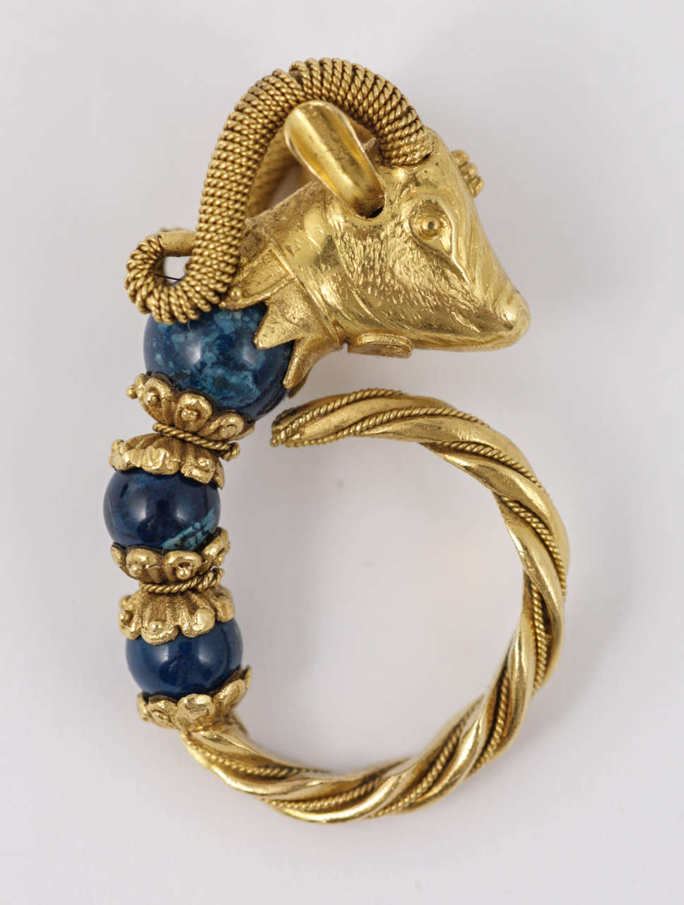 Hellenistic inspired Bull and Sodalite Ring in granulation and wirework.

High carat gold, with Maker's Marks, size (UK) J.