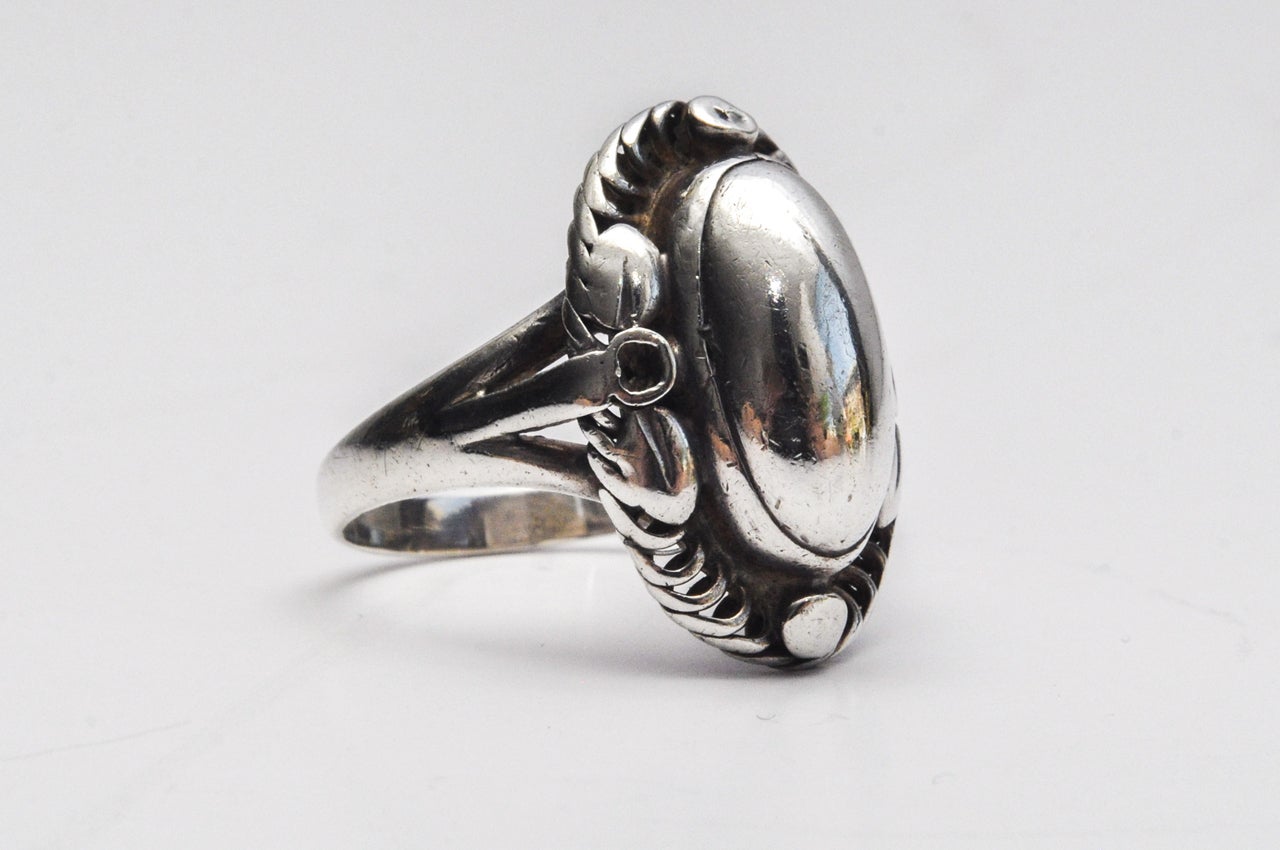 A sterling silver ring by Georg Jensen with delicate scroll work and beautiful detailing from the Art Deco period. A comfortable fit.

Ring size 6.75